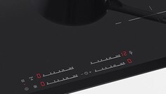 Primer plano de los controles de la placa de inducción